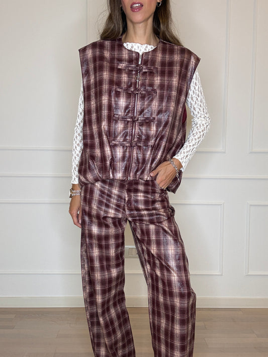 Gilet check spalmato con alamari