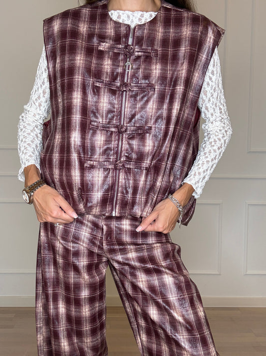 Gilet check spalmato con alamari