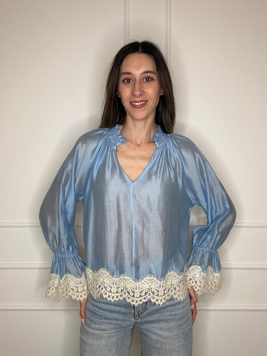 Blusa tinta unita con pizzo